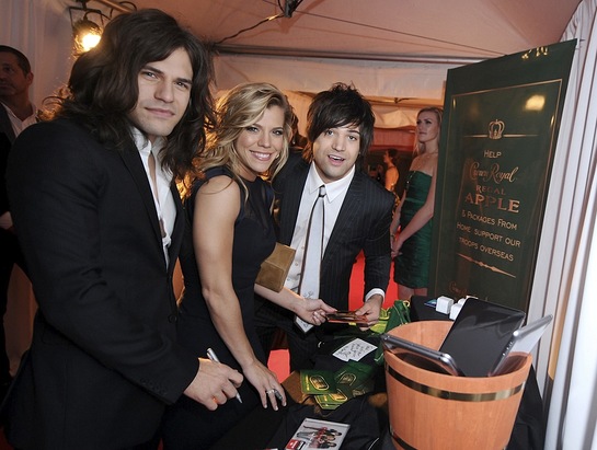 Reid Perry, Kimberly Perry, and Neil Perry of The Band Perry take a moment to pack a Crown Royal Regal Apple care package