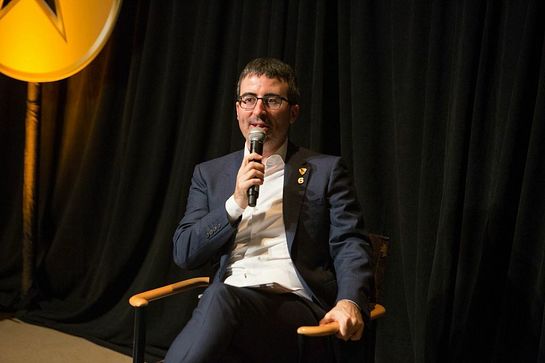 John Oliver interviewing a veteran on stage during the second annual Got Your 6 Storytellers event at HBO in NYC