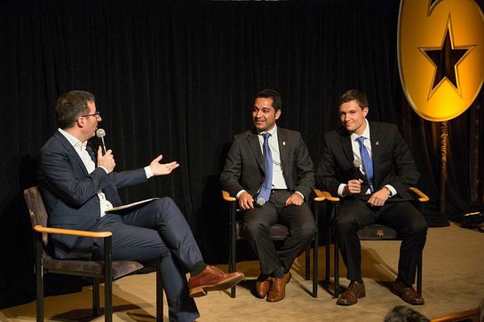 Comedian John Oliver interviewing a veteran on stage during the second annual Got Your 6 Storytellers event at HBO in NYC