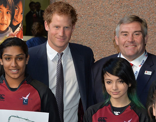 Prince Harry, with Jason Leonard, meets young beneficiaries of the Rugby All Schools Programme at the Annual ICAP Charity Day