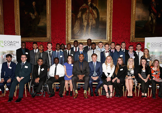 Prince Harry and NBA All-Star Carmelo Anthony have a group photograph with Coach Core apprentices at the Coach Core Graduation at St James's Palace.