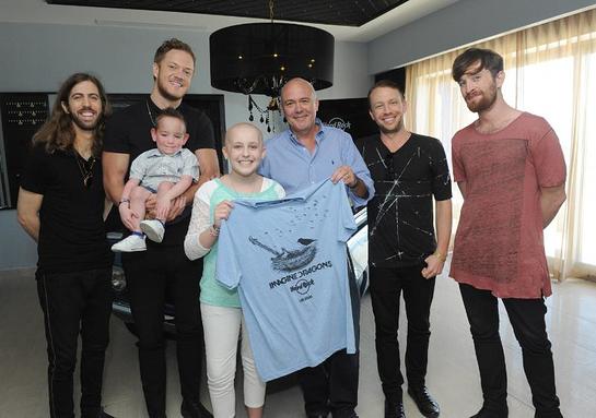 Hamish Dodds, CEO of Hard Rock International, Wayne Sermon, Dan Reynolds, Ben McKee and Daniel Platzman of Imagine Dragons, meet with Christian Smith and Kate Pierson, who have benefitted from the Tyler Robinson Foundation