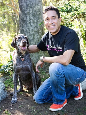 Oscar Nunez, with his rescue dog Gus