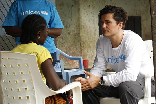 Orlando Bloom meets with Sophia Vaye, a single mother, in the rented house where she and her five children live, in Tubmanburg in Bomi County