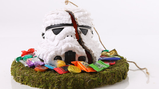 Bid on a selection of plaster stormtrooper helmet replicas uniquely decorated by artists around the world