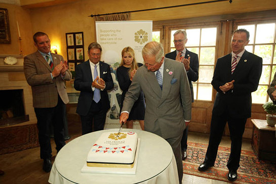 Prince Charles cuts a cake to mark the 5th anniversary of The Prince's Countryside Fund