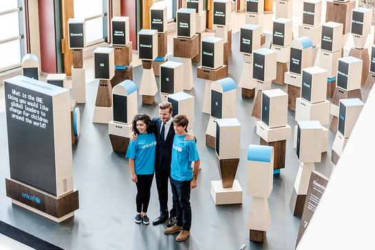 Noor Samee, 16, UNICEF Goodwill Ambassador David Beckham and Rodrigo Bustamante, 17, stand in front of the unique new digital installation Assembly of Youth