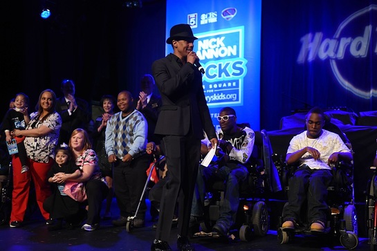 Nick Cannon onstage with St. Mary's kids