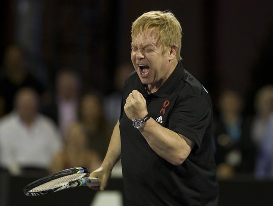 Elton John is fired up in the opening set of celebrity doubles.