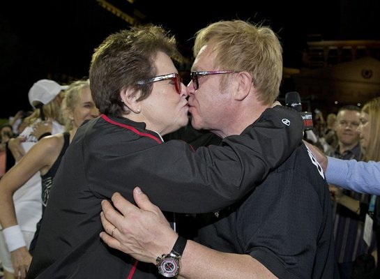 Elton John and Billie Jean King receive a check from Mylan Chief Marketing Officer Deb O'Brien