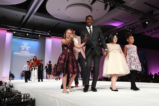 Jamie Foxx and his daughter, Annalise, escort models with Down syndrome on the catwalk. 